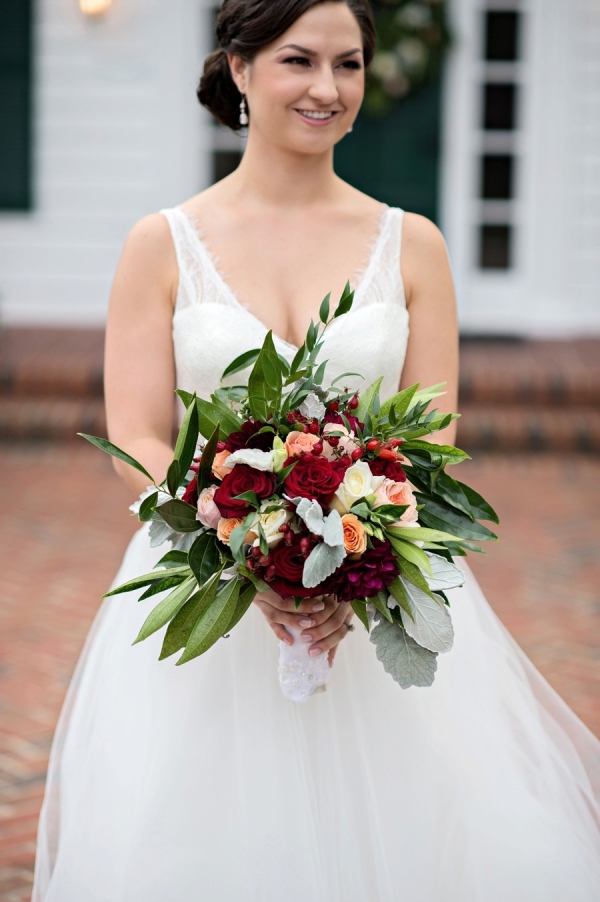 Rustic and romantic red bouquet with greenery