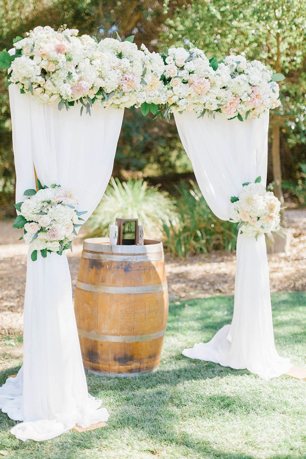 Floral and draping ceremony backdrop