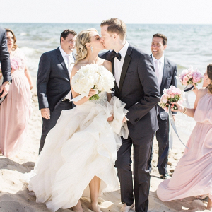 Blush bridal party on beach