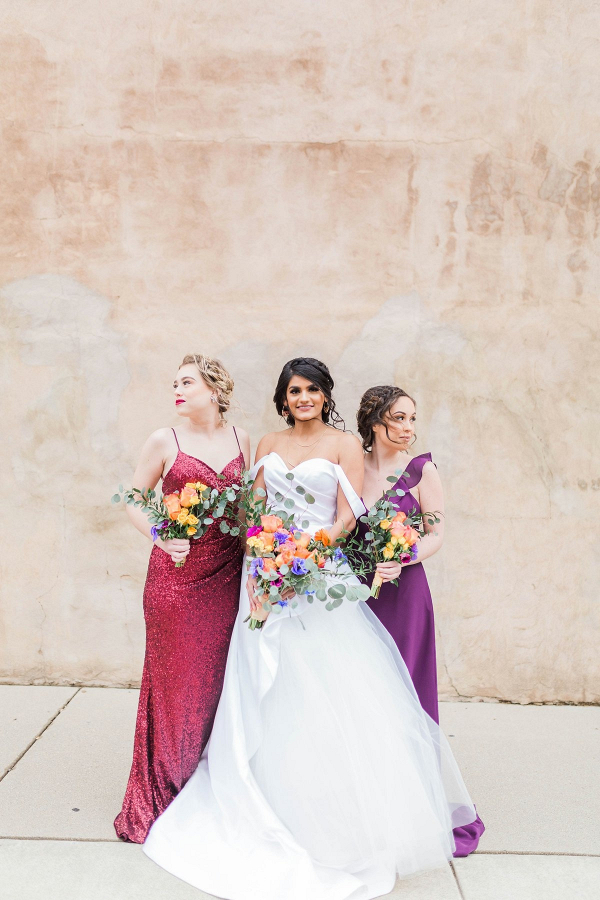 Jewel toned bridal party in mismatched dresses