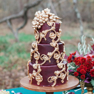 Burgundy and gold wedding cake