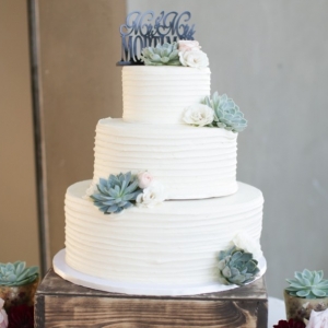 Buttercream wedding cake with succulents 