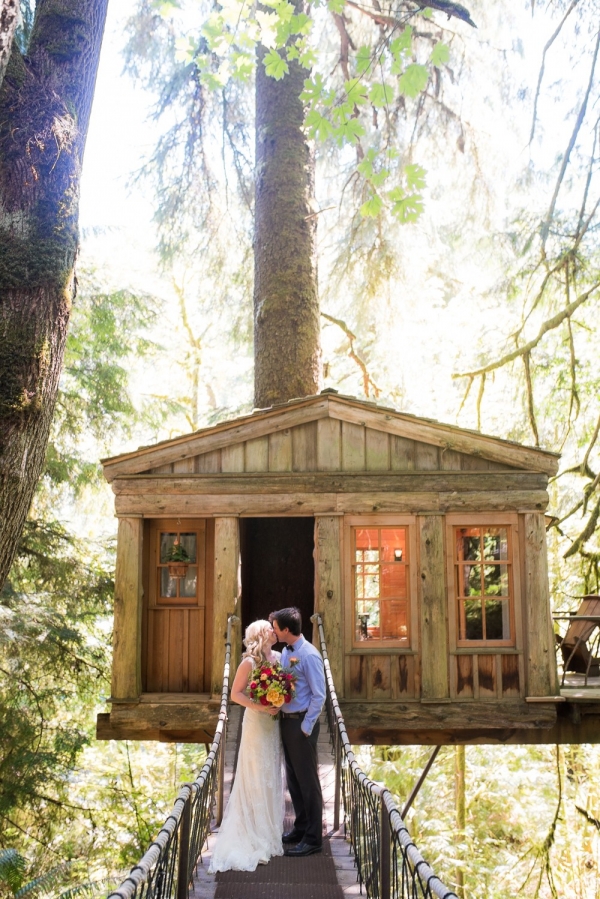 Bride And Groom In Front Of A Treehouse Venue