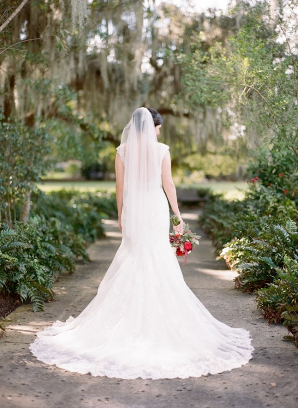 Bride with fanned out wedding gown train 
