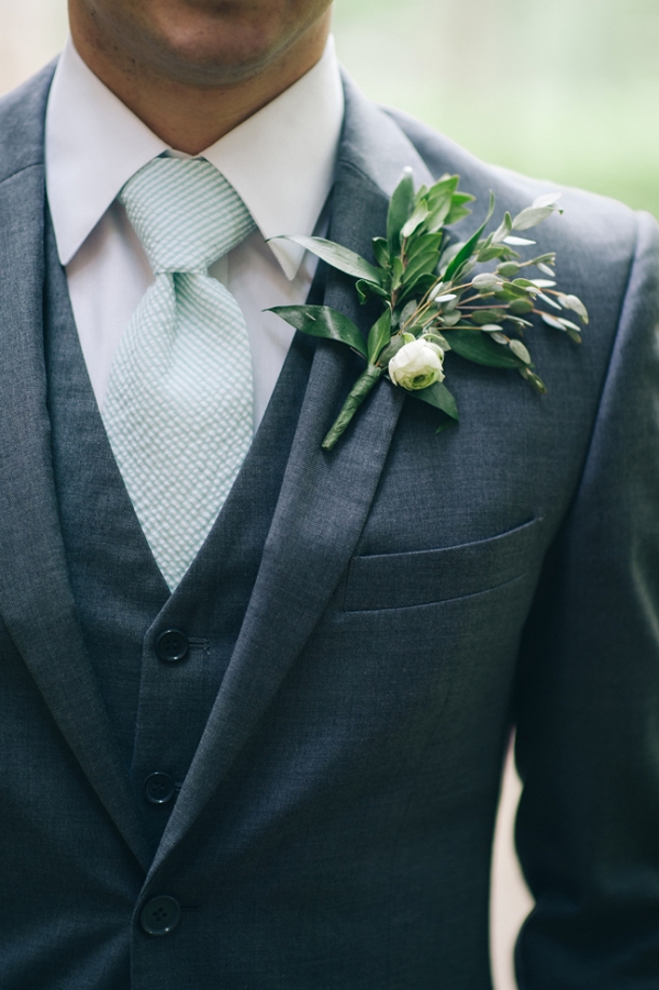 Groom in Gray Suit with a Green & White Boutonniere