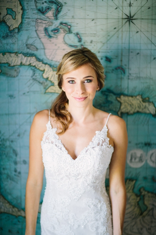 Beautiful bride in front of wall map