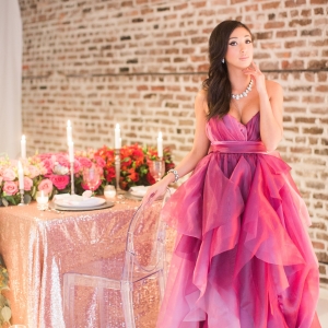 Bright pink and red ombre gown with gold romantic table