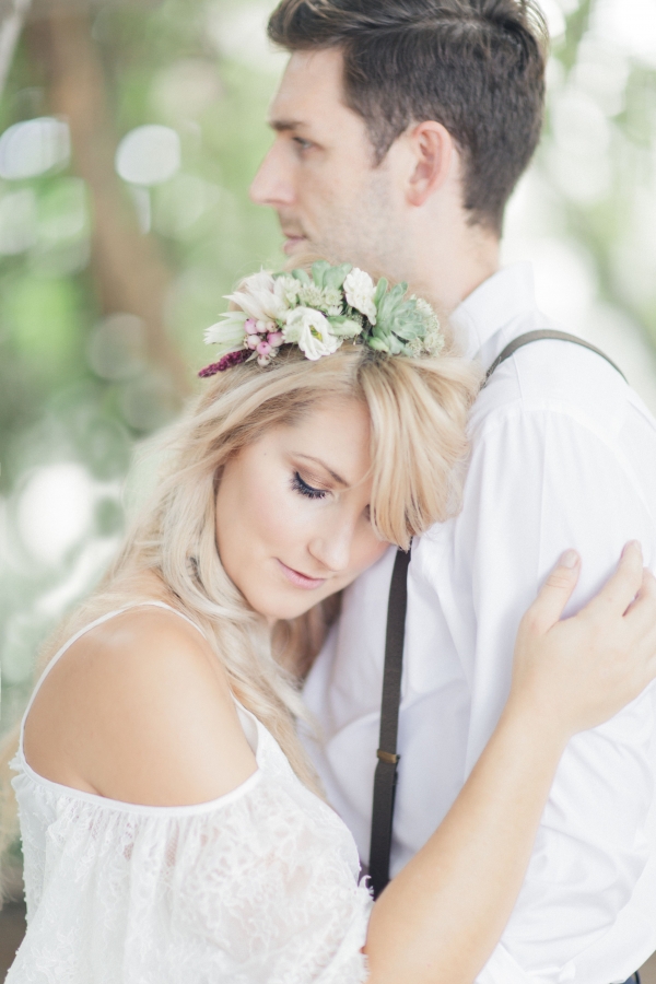 Bohemian bride and groom sweet embrace