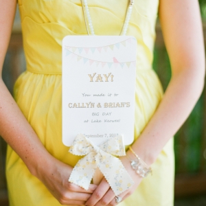Pretty stationery and bridesmaid in yellow