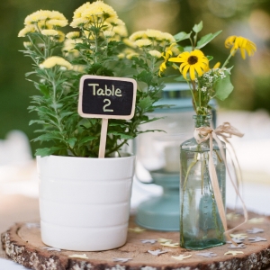 Pot of mums with small chalkboard sign
