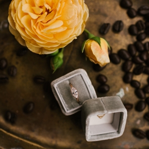 Engagement Ring Surrounded By Coffee Beans