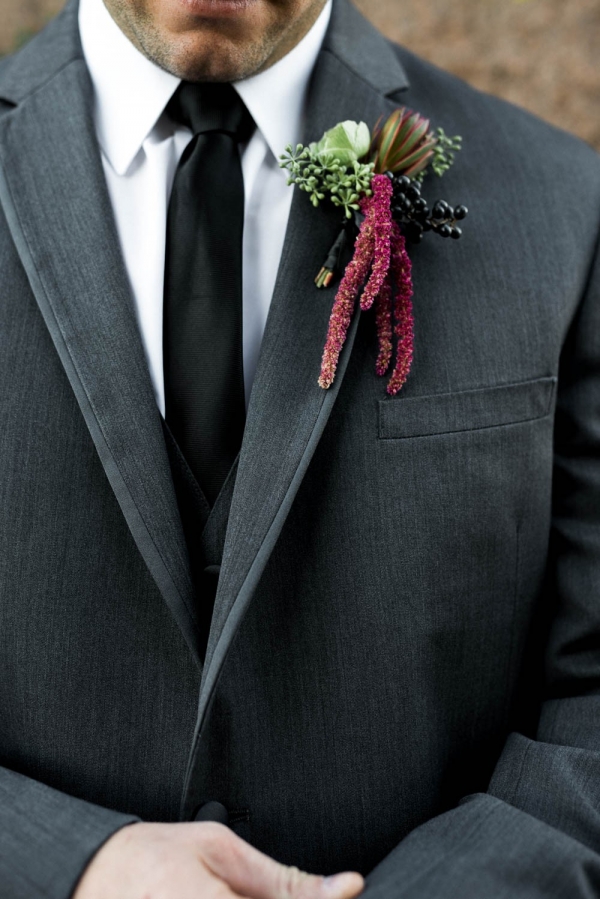 Handsome groom in gray suit