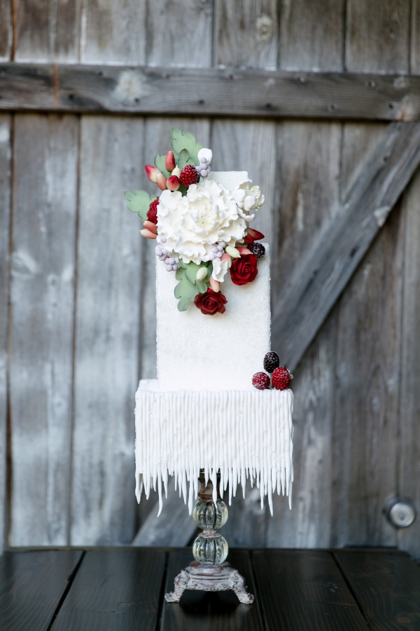 Modern red and white cake with icicle-like bottom 