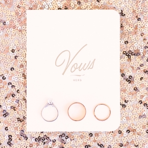 Vows and rings on rose gold sequins