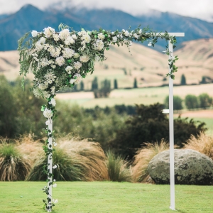 New Zealand ceremony arch with white and green flowers