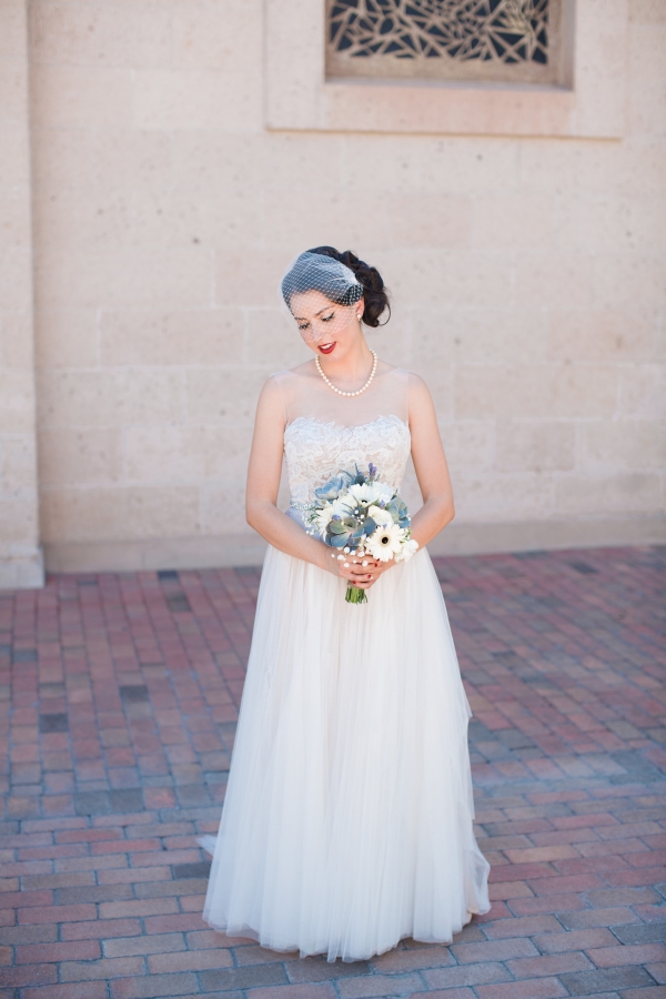 Bride in BHLDN Penelope gown with succulent, Gerber Daisy, rose and lavender bouquet