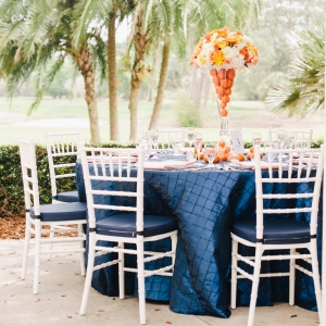 Orange, Navy Blue, and white citrus wedding tables