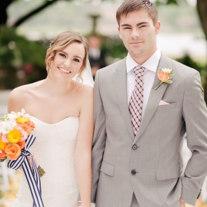 Bride and groom in orange and Navy Blue citrus wedding inspiration