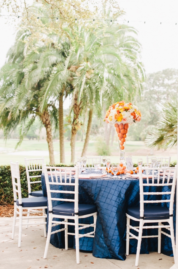 Orange, Navy Blue, and white citrus wedding tables