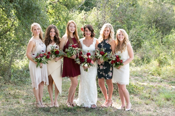 Bride with bridesmaids in wine, black, and white mismatched dresses