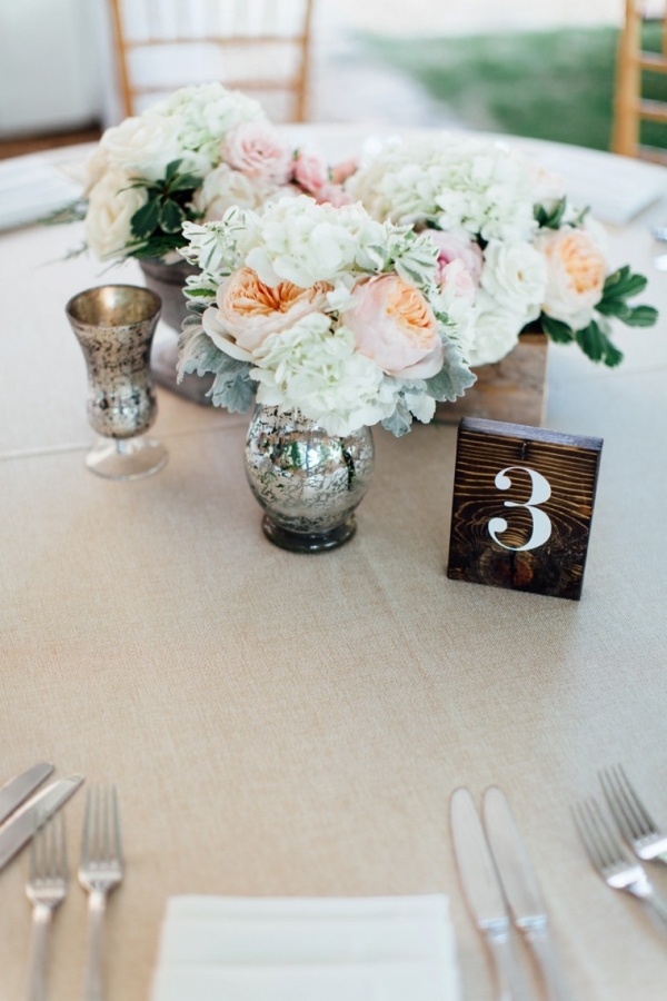 Blush and white centerpiece with wood table number