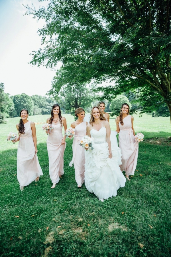 Ruffle wedding dress and blush bridesmaids