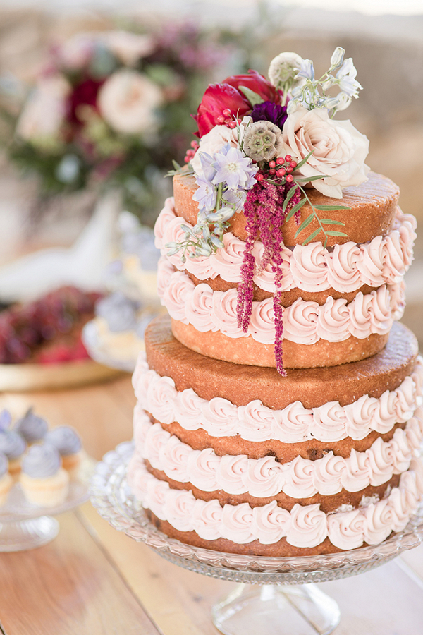 Naked wedding cake with swirled buttercream