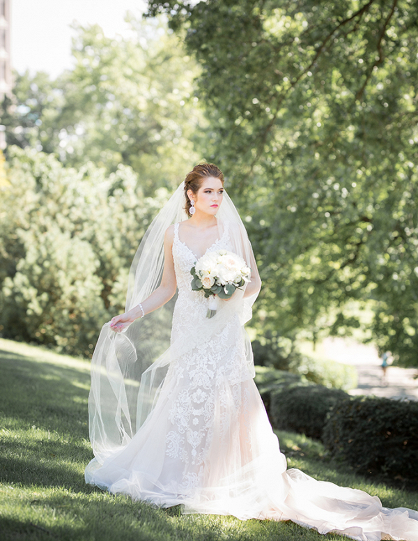 Bride in lace dress and cathedral veil
