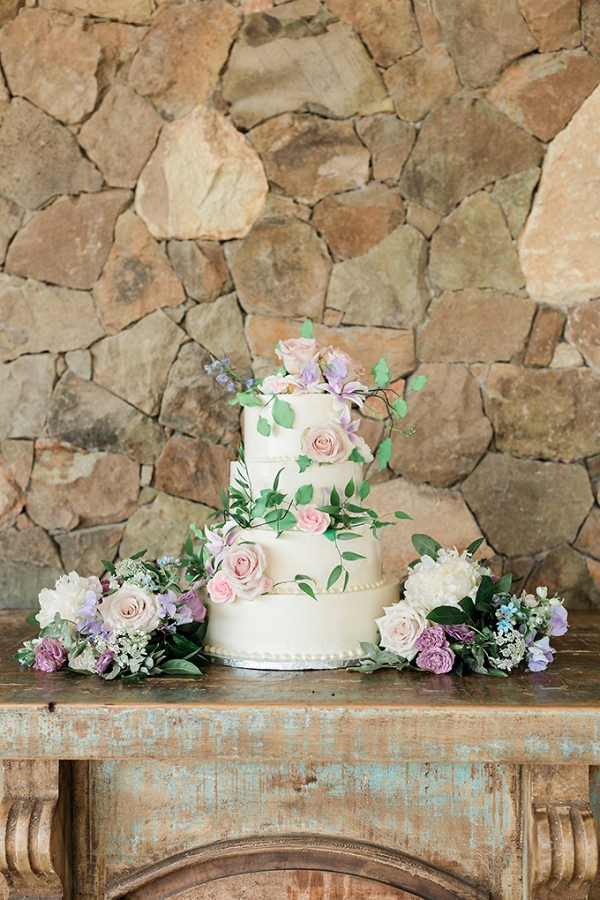 Wedding cake with purple and pink florals
