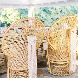Peacock chairs with bride and groom macrame signs