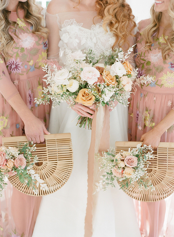 Bridesmaids with rattan purse bouquets