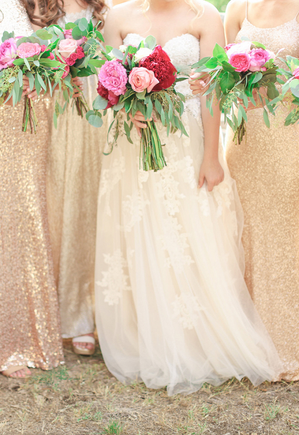 Bridesmaids in mismatched gold sequin and lace dresses