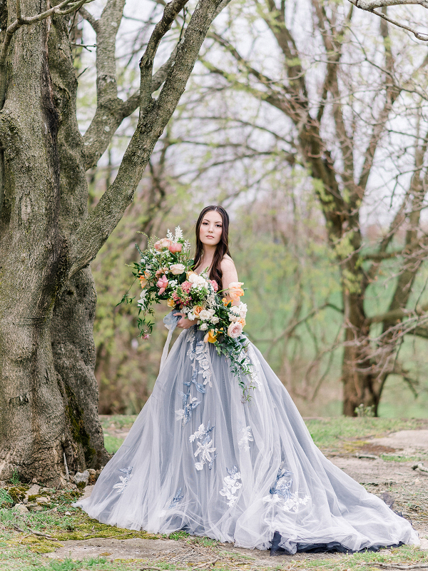 bride in a blue ballgown wedding dress