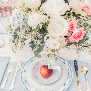 fine china place setting with a peach