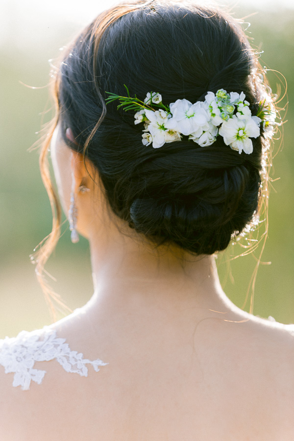 Bride with white floral hair comb