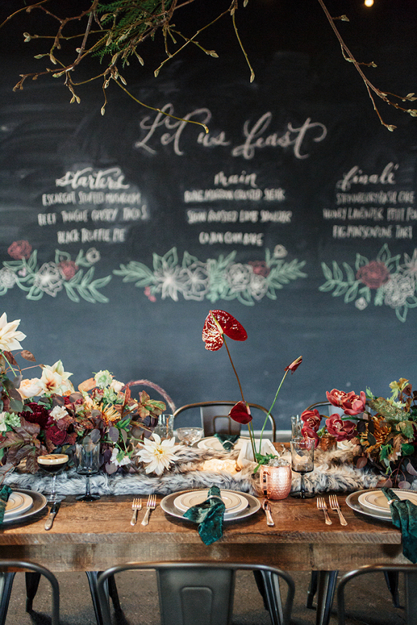 Industrial Wedding Reception with a Chalkboard Menu and Hanging Greenery
