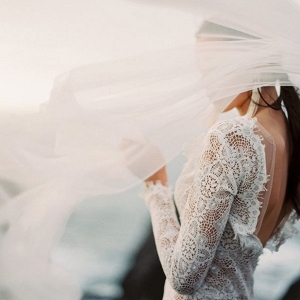 Long Sleeve Wedding Dress with a Low Back and an Ethereal Veil
