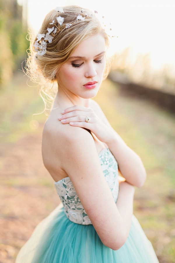 Graceful Bridal Updo with a Delicate Halo Headpiece