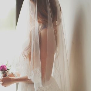 Dreamy Bride with a Lace Trimmed Veil