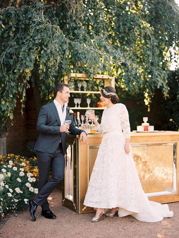 Bride and Groom Raising a Toast with Vintage Champagne Coupes