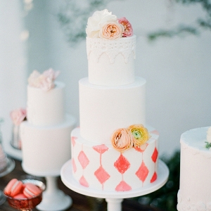 Coral and White Patterned Wedding Cake Display