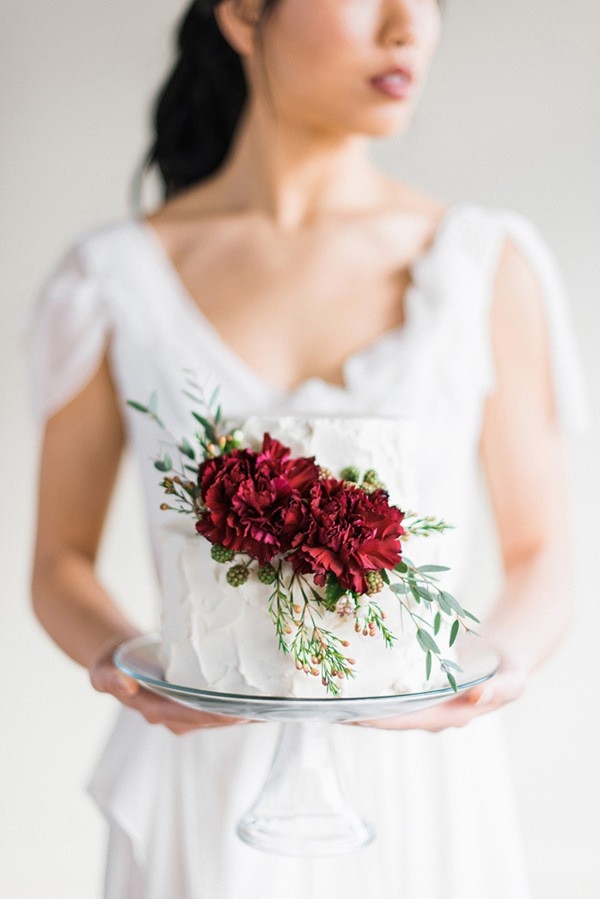 Delicate Wedding Cake with a Rich Burgundy Floral Topper