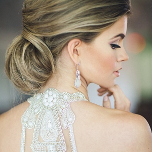 Elegant Bridal Chignon with a Beaded Illusion Back Wedding Dress