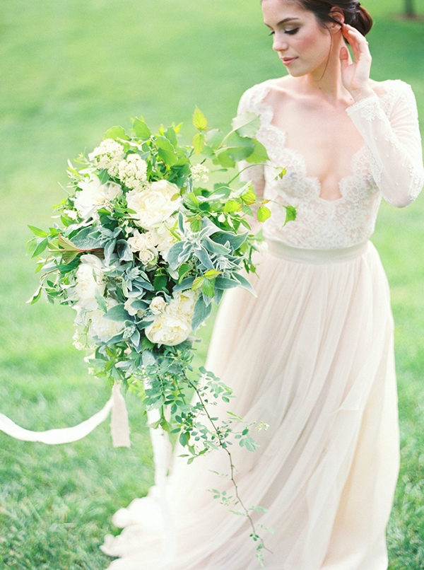 Long Sleeve Lace Wedding Dress with a Greenery Bouquet
