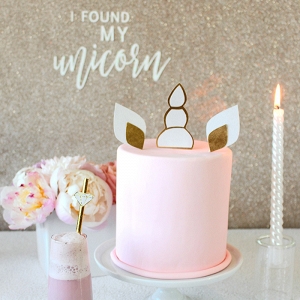 Unicorn Cake Topper with a DIY Glitter Banner Backdrop