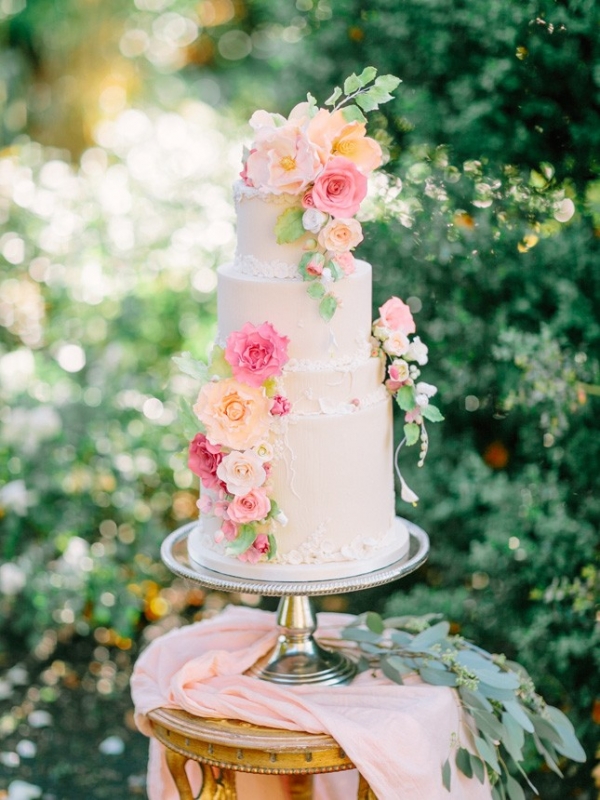 Garden Wedding Cake in Pastel Shades of Peach, Yellow, and Pink