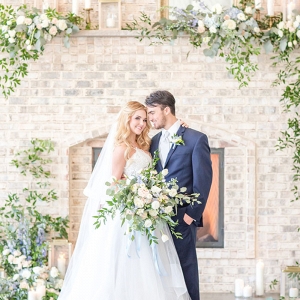 Stone Fireplace with Greenery and Spring Flowers for a Ceremony Altar