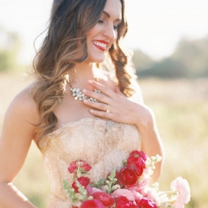 A Gold Wedding Dress and Bright Pink Bouquet