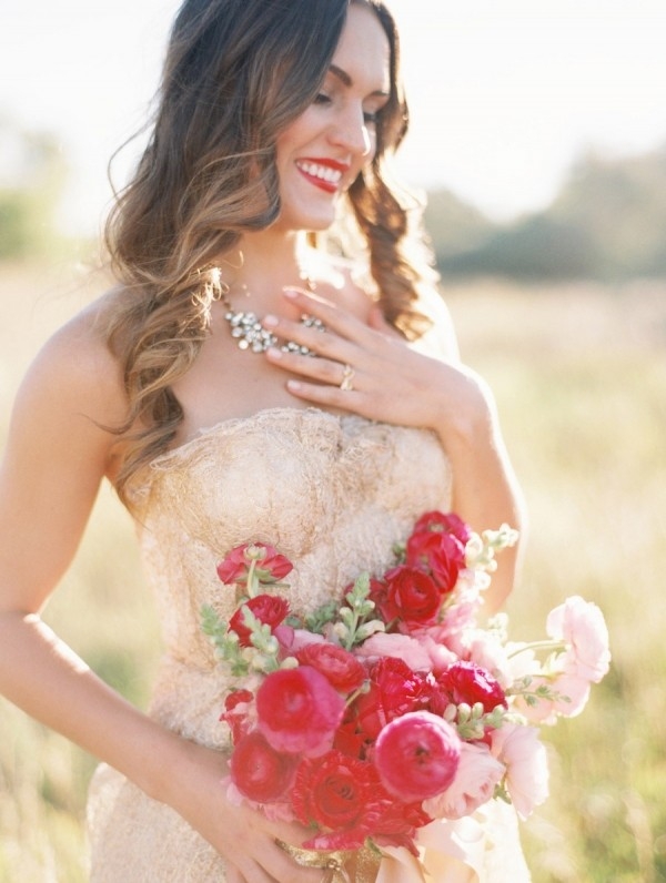 A Gold Wedding Dress and Bright Pink Bouquet