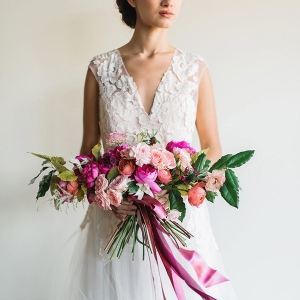 Dreamy Lace and Tulle Wedding Dress with a Modern Pink Bouquet